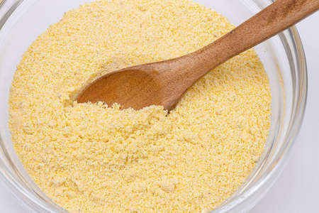 Corn Flour in the bowl with Wooden Spoonの写真素材