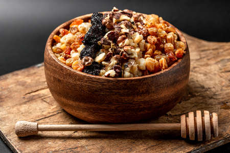 Wheat porridge with raisins, poppy seeds, walnuts and honeyの写真素材