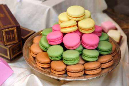 Colourful sweet macaroons, a sugary dessert, in red, pink, blue, green, and yellow huesの写真素材