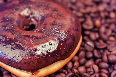chocolate donuts coffee beans sweet dessert selective soft focus toned photoの写真素材