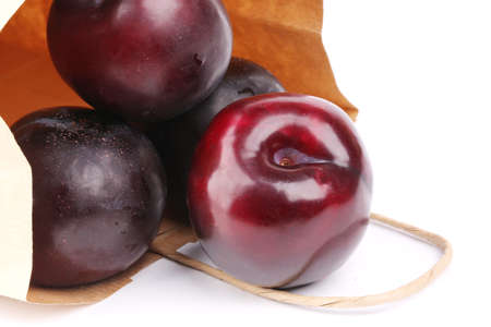 plum isolated on white background paper shopping bagsの写真素材