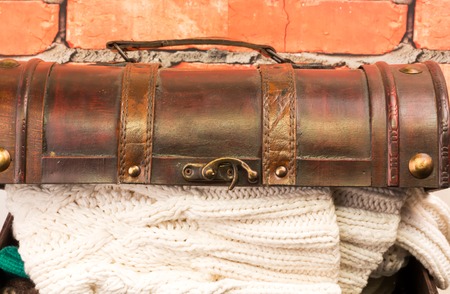 chest with knitted woolen winter clothes retro vintageの写真素材