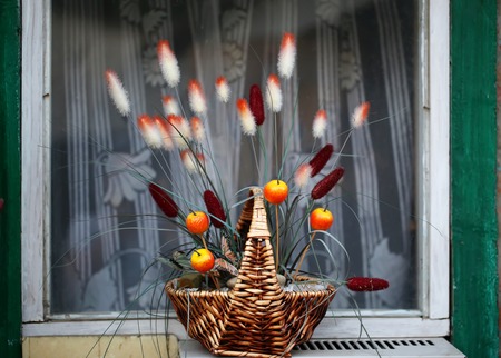 Window decorations ears of corn basket apples autumn flowersの写真素材