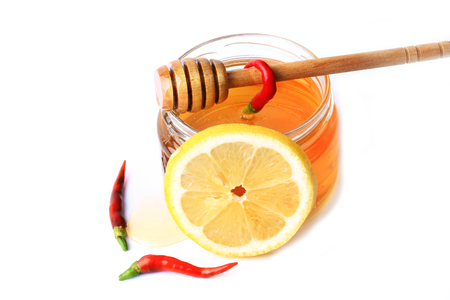 honey chilli lemon isolated on white backgroundの写真素材