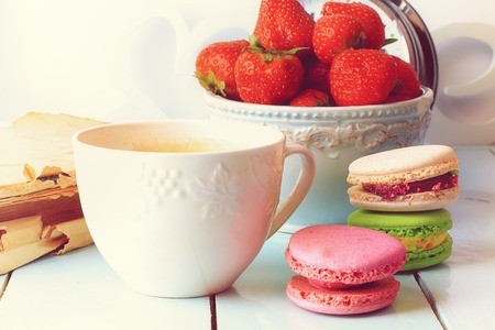coffee macaroon old book retro vintage French dessert eco organic healthy lifestyle soft selective focusの写真素材