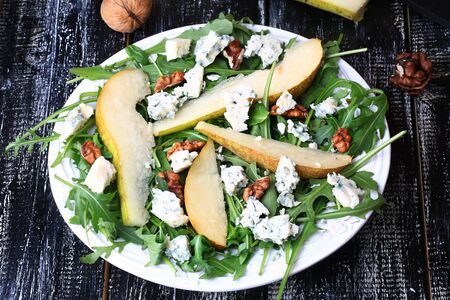 arugula pear salad blue cheese walnutの写真素材