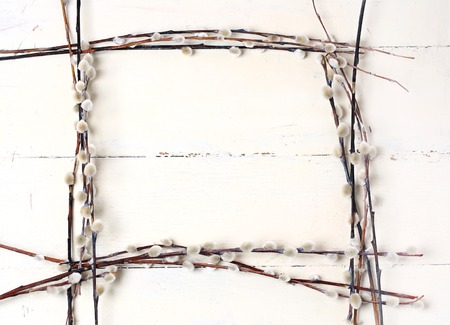 willow frame on white vintage wooden background Spring composition Easter