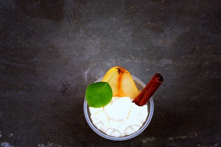 pudding of pear and cinnamon on a stone backgroundの写真素材