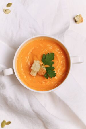 pumpkin soup with garlic croutons top viewの写真素材