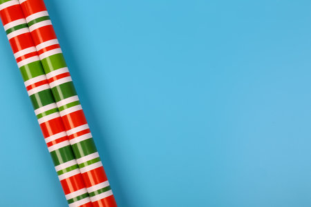 gift wrapping paper on a blue background. minimalistic christmas scandy background with empty place for text. top view, flat styleの写真素材