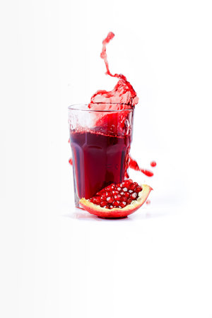 pomegranate juice on a white backgroundの写真素材