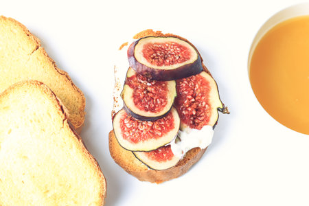 healthy breakfast. sandwich with soft cheese, figs and honeyの写真素材