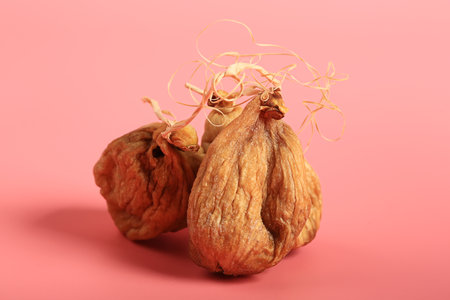 figs dried on a pink background. Creative minimalist style. healthy food