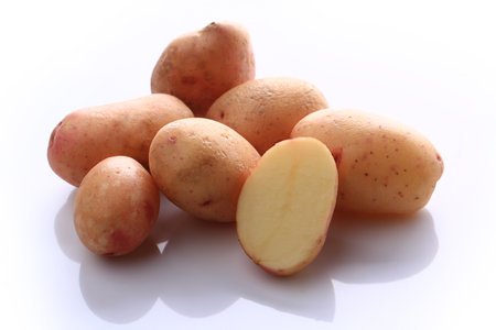 raw potatoes isolated on white backgroundの写真素材