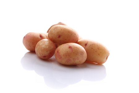 raw potatoes isolated on white backgroundの写真素材