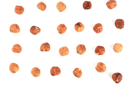 peeled hazelnuts pattern isolated on white backgroundの写真素材