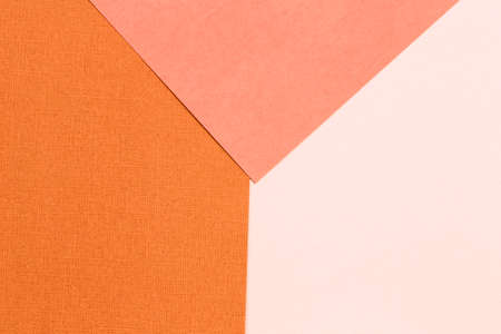 Geometric paper background of yellow and orange. Copy space, place for your text. Top view.の写真素材
