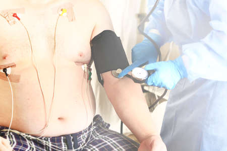 doctor measures the pressure to the patient. Medical concept. Selective focusの写真素材