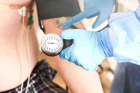 doctor measures the pressure to the patient. Medical concept. Selective focusの写真素材