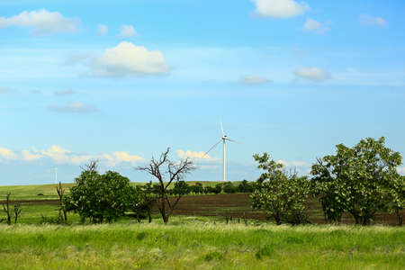 Wind power plant. Wind turbine green energy. Taking care of nature ..