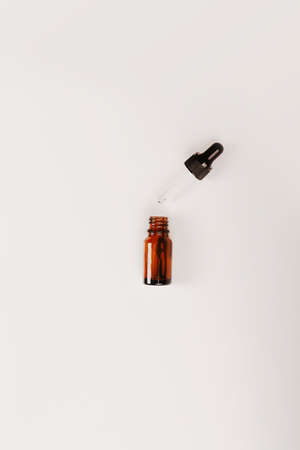 Bottles of dark amber glass. Natural cosmetic. Flat style, top viewの写真素材