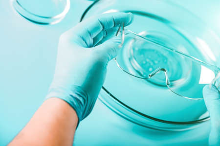 Medical abstract background. Petri dishes and glass pipette.