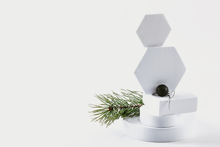 Christmas composition. Spruce branches podium cones and Christmas ballsの写真素材
