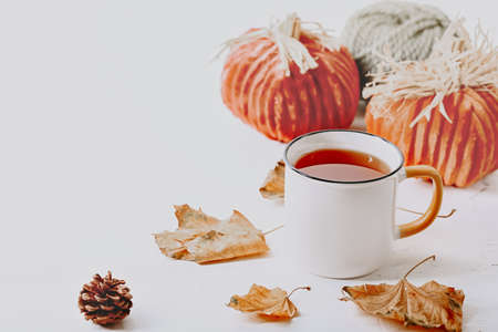 Autumn composition. Cup of tea and autumn leaves