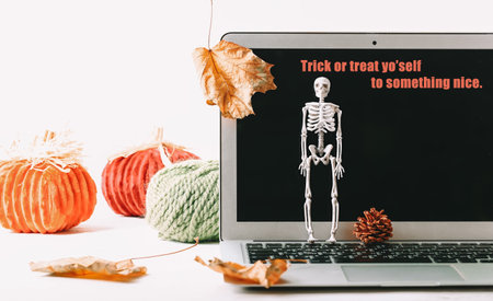 Autumn mockup. Halloween sale. Notebook skeleton autumn leavesの写真素材