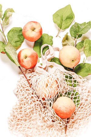 Apples in an eco-friendly grid. Autumn composition. natural farm productの写真素材