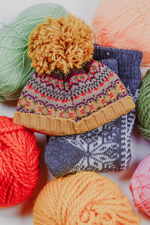 Knitting. Knitting warm clothes on your own. Tangles of wool and knitted things