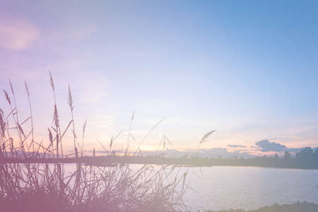 Sunset sky and cloud at lake, Filter color.の写真素材