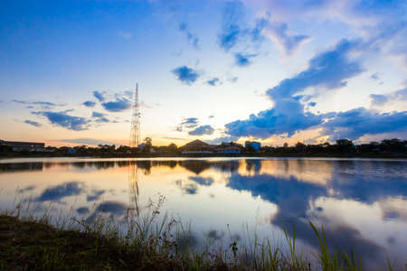Dramatic sky sunset with reflection on the lake.の写真素材