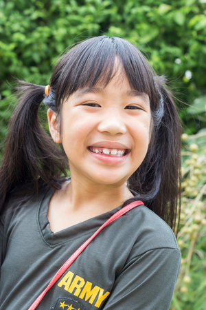 Portrait of a beautiful little girl close-up.の写真素材