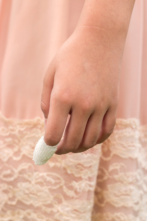 girl's injured finger tapedの写真素材