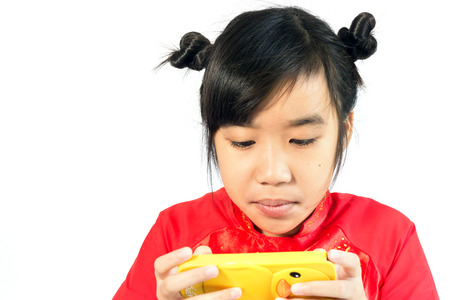 Asian girl using smartphone isolated on a white backgroundの写真素材