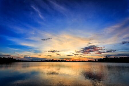 Sunset with reflection on the lakeの写真素材