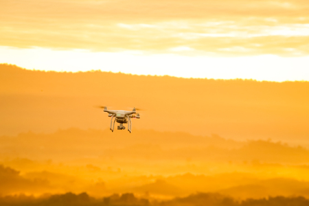 Nongkhai, Thailand - Jan 3, 2017: Drone DJI Phantom standard 3 flying in the air with mounted digital camera for video and photo productions over mountain on Jan 3, 2017 in Nongkhai, Thailand.のeditorial素材