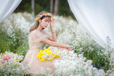 Beautyful Asian woman in the flower gardenの写真素材