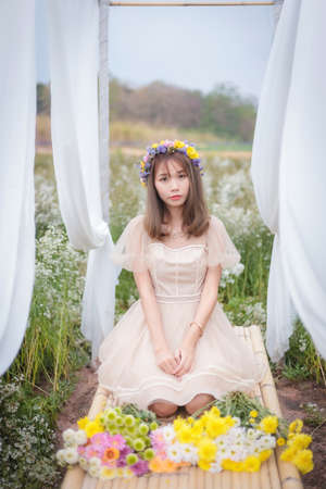 Beautyful Asian woman in the flower gardenの写真素材