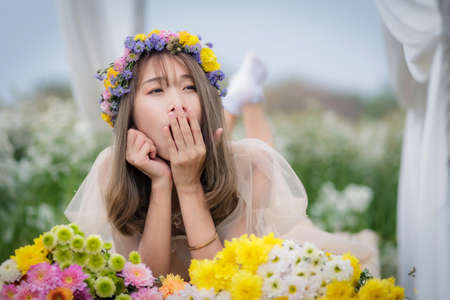 Beautyful Asian woman in the flower gardenの写真素材