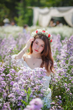 Beautyful Asian woman in the flower gardenの写真素材