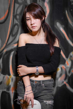 Night portrait of beautiful Asian girl in Thailand.の写真素材