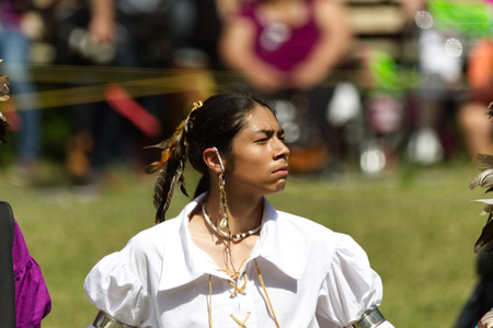 Kahnawake, Quebec, Canada - July 9, 2017: Pow Wow in Kahnawake Reserve for their 27th Annual Echoes of Proud Nation Pow Wow. Proud young man dancerのeditorial素材