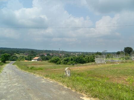 Beautiful rural road in India, Beautiful Rural village road landscape greenery with skyの写真素材