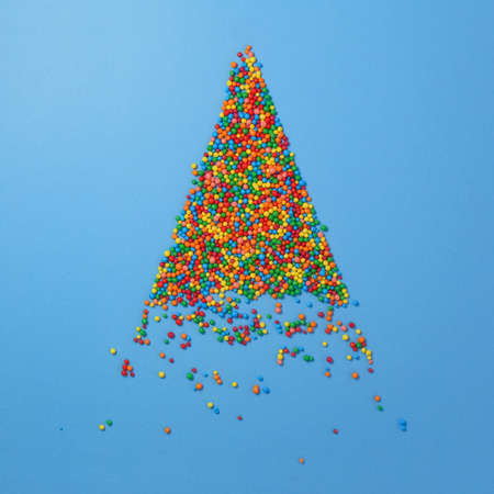 Christmas tree made of colored sugar balls. New year and christmas postcard.