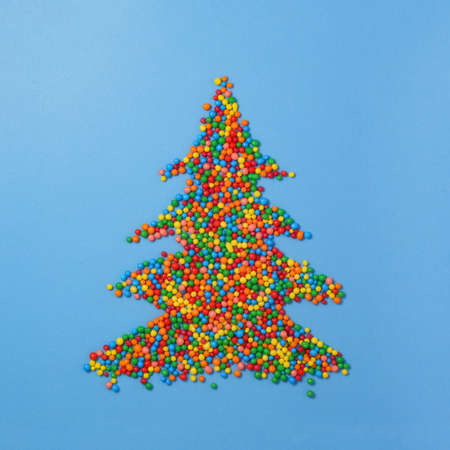 Christmas tree made of colored sugar balls. New year and christmas postcard.