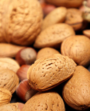 Almond nuts and hazelnut background. Almond with shell. Selective focus