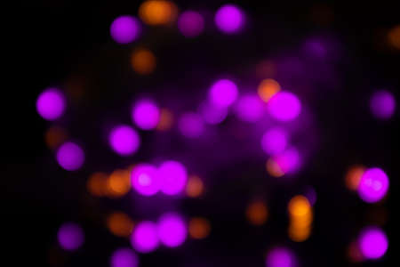 Bright Christmas blurred background with lilac colour garlands.の写真素材