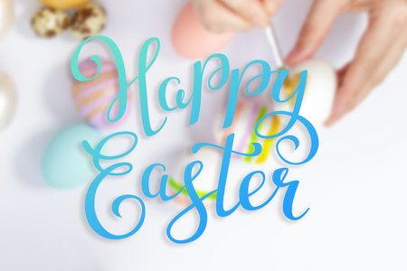 Bright easter eggs with happy Easter lettering, holiday concept. Selective focusの写真素材